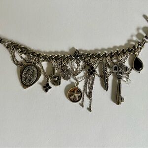 Lucky Brand Vintage Silver Charm Bracelet with numberous charms and dangles.
